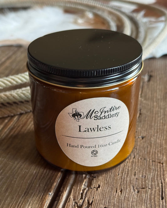 Jar of candle on a wooden surface with a visible label