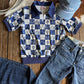 Checkered shirt, jeans, and cap on a wooden surface with cowhide rug