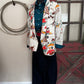 Outfit featuring  printed blazer with a red barn door in the background