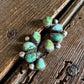 cluster earrings on a wooden surface 