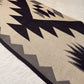 Rug with geometric pattern on a light-colored floor
