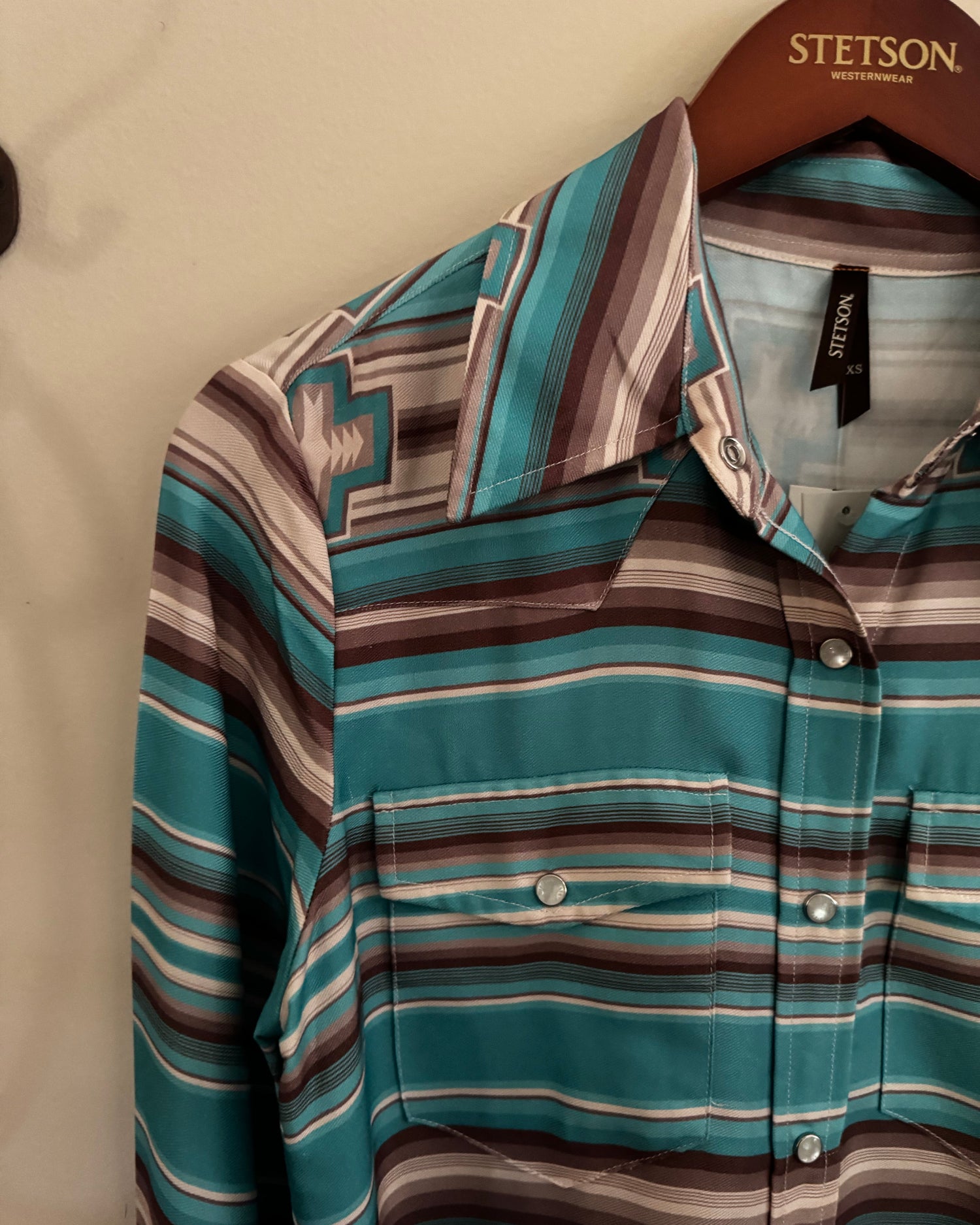 Striped shirt on a hanger with Stetson branding