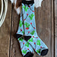 Colorful sock with floral pattern on a wooden surface