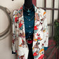 Patterned blazer on a mannequin with a door in the background