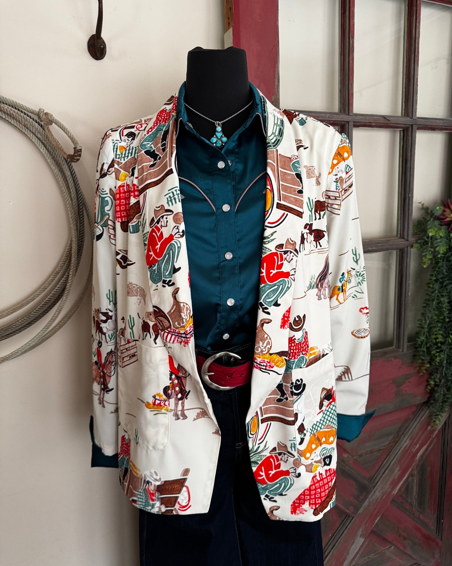 Patterned blazer on a mannequin with a door in the background