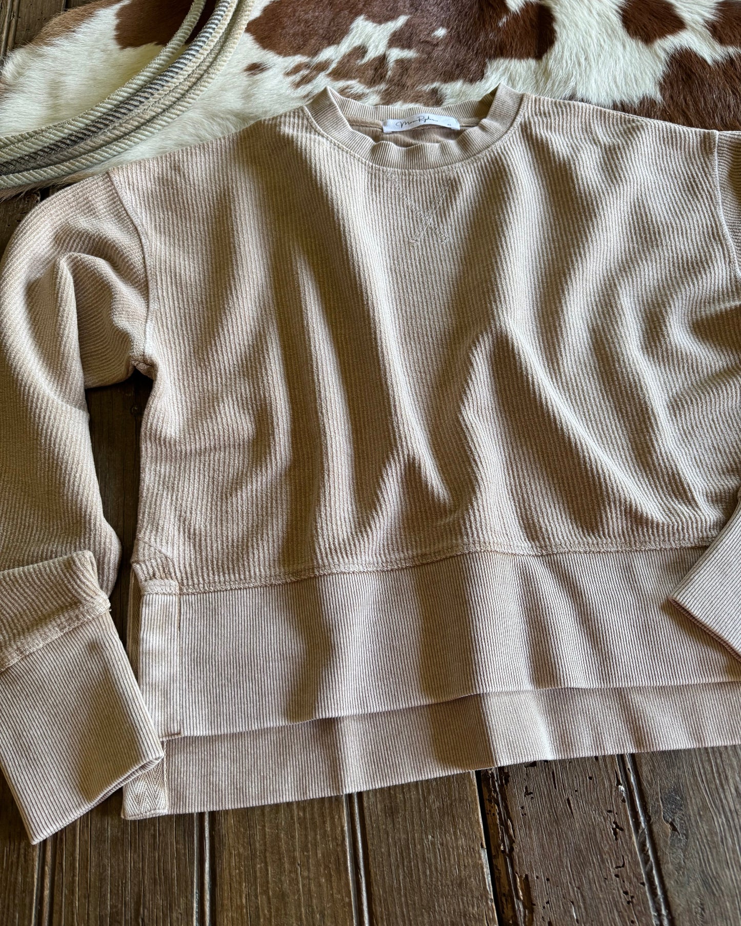 Beige shirt on a wooden surface