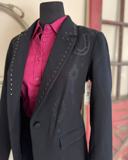 Black blazer with pink shirt on a mannequin against a neutral background