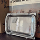 Silver tray on a wooden surface with a book titled 'Frederic Remington' in the background.