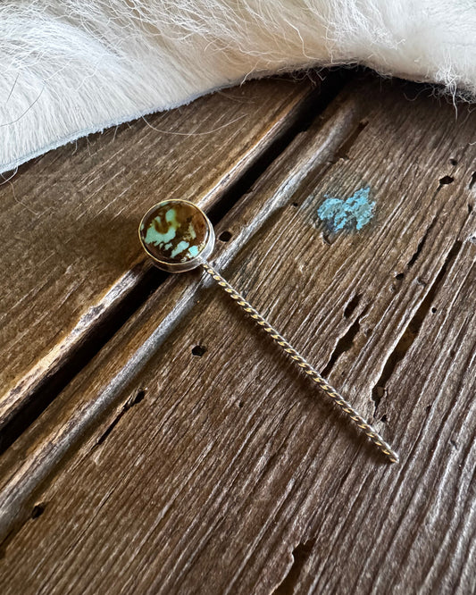 Necklace with a pendant on a wooden surface