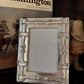 Decorative picture frame with cowboy theme in the background