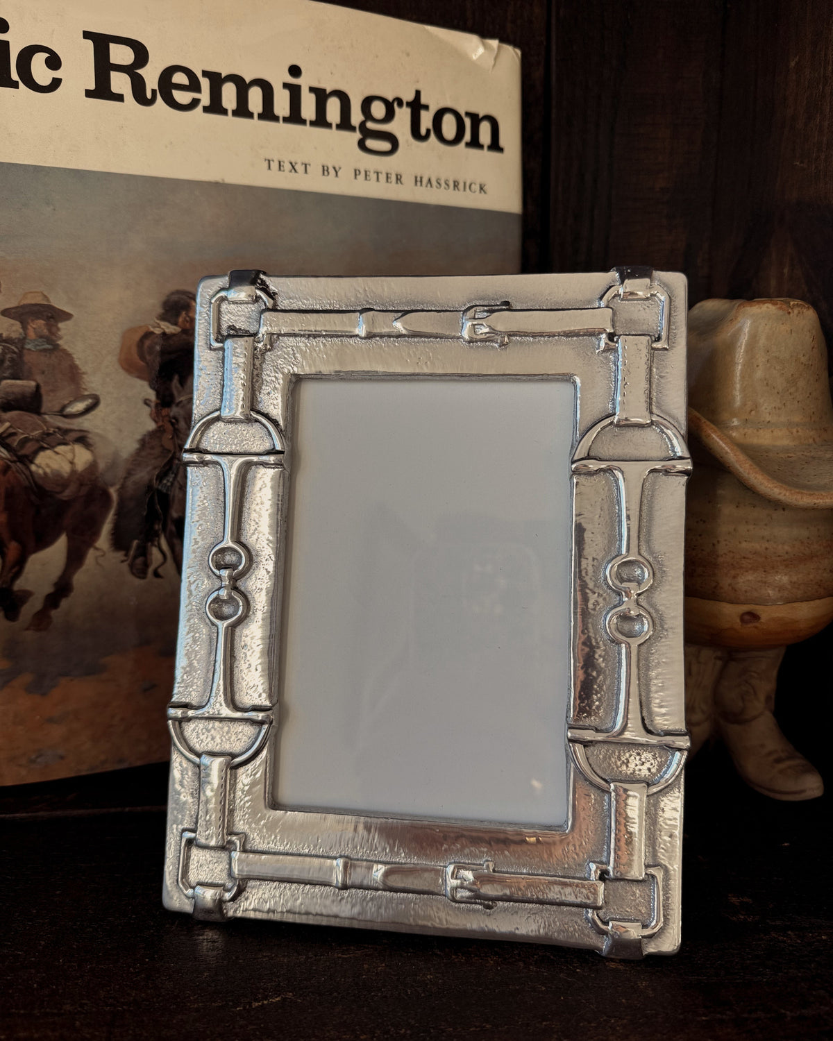Decorative picture frame with cowboy theme in the background