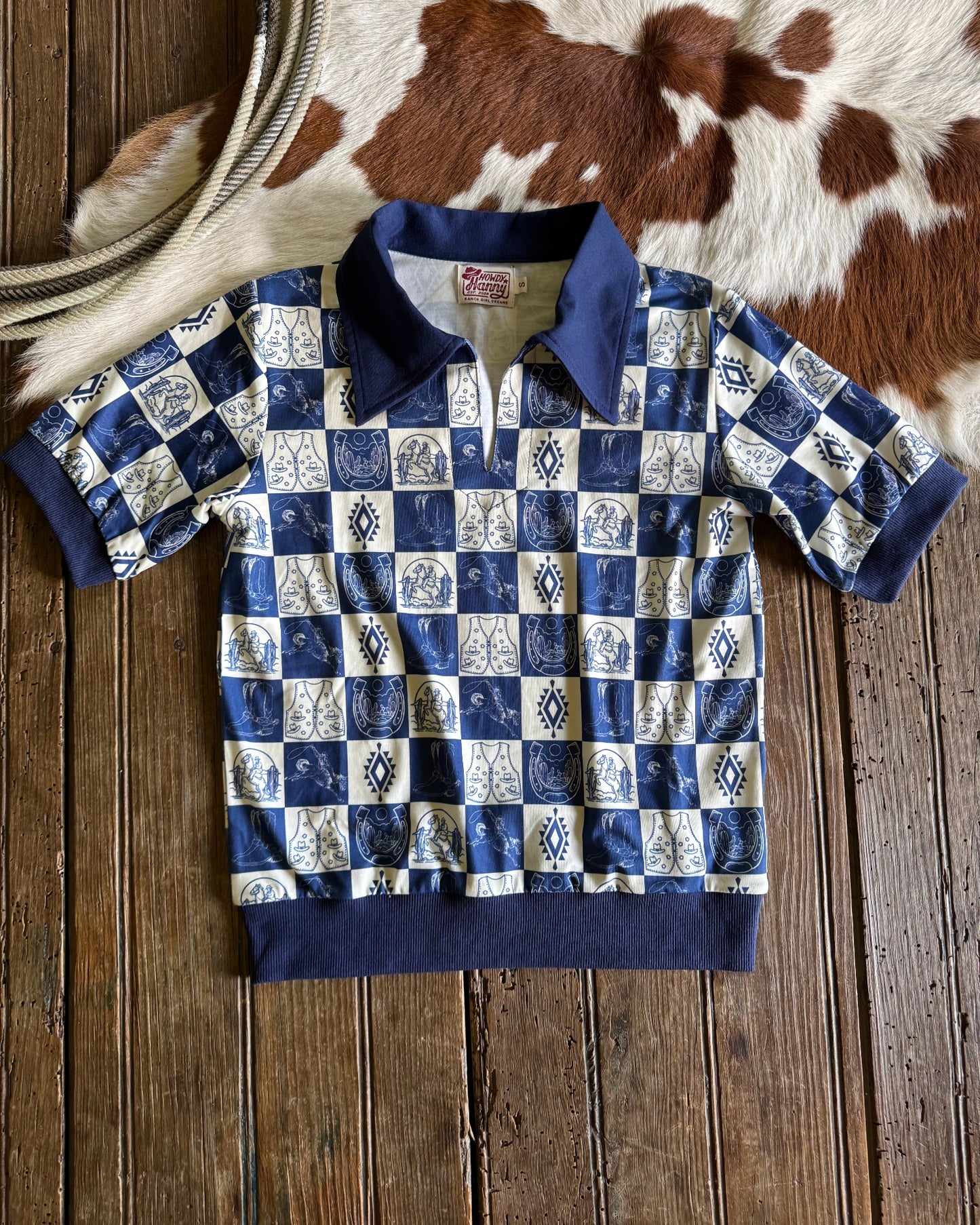 Blue and white checkered shirt on a wooden surface
