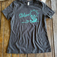 Gray t-shirt with Stetson logo on a wooden surface