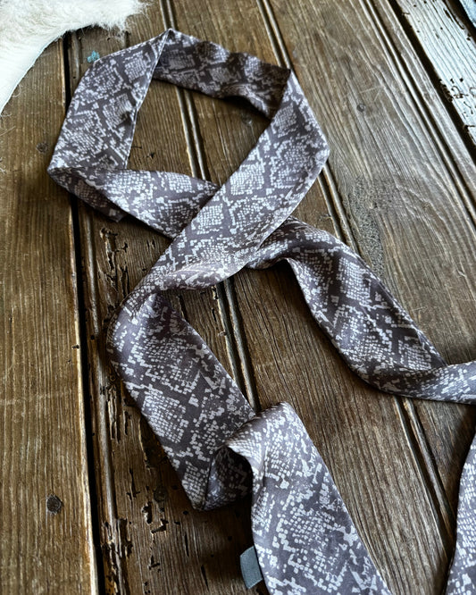 Patterned fabric strip on a wooden surface