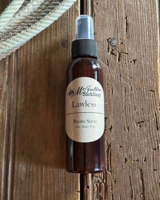 Small brown spray bottle with a label on a wooden surface