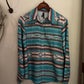 Folded patterned shirt on a white surface