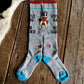 Gray socks with colorful design on a wooden surface