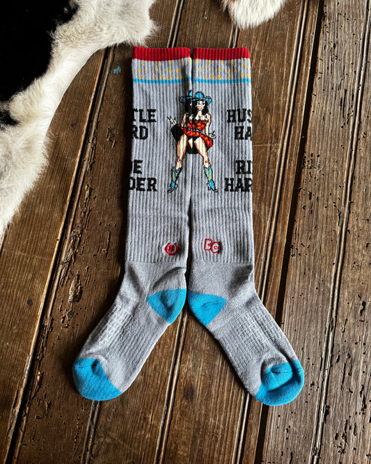 Gray socks with colorful design on a wooden surface