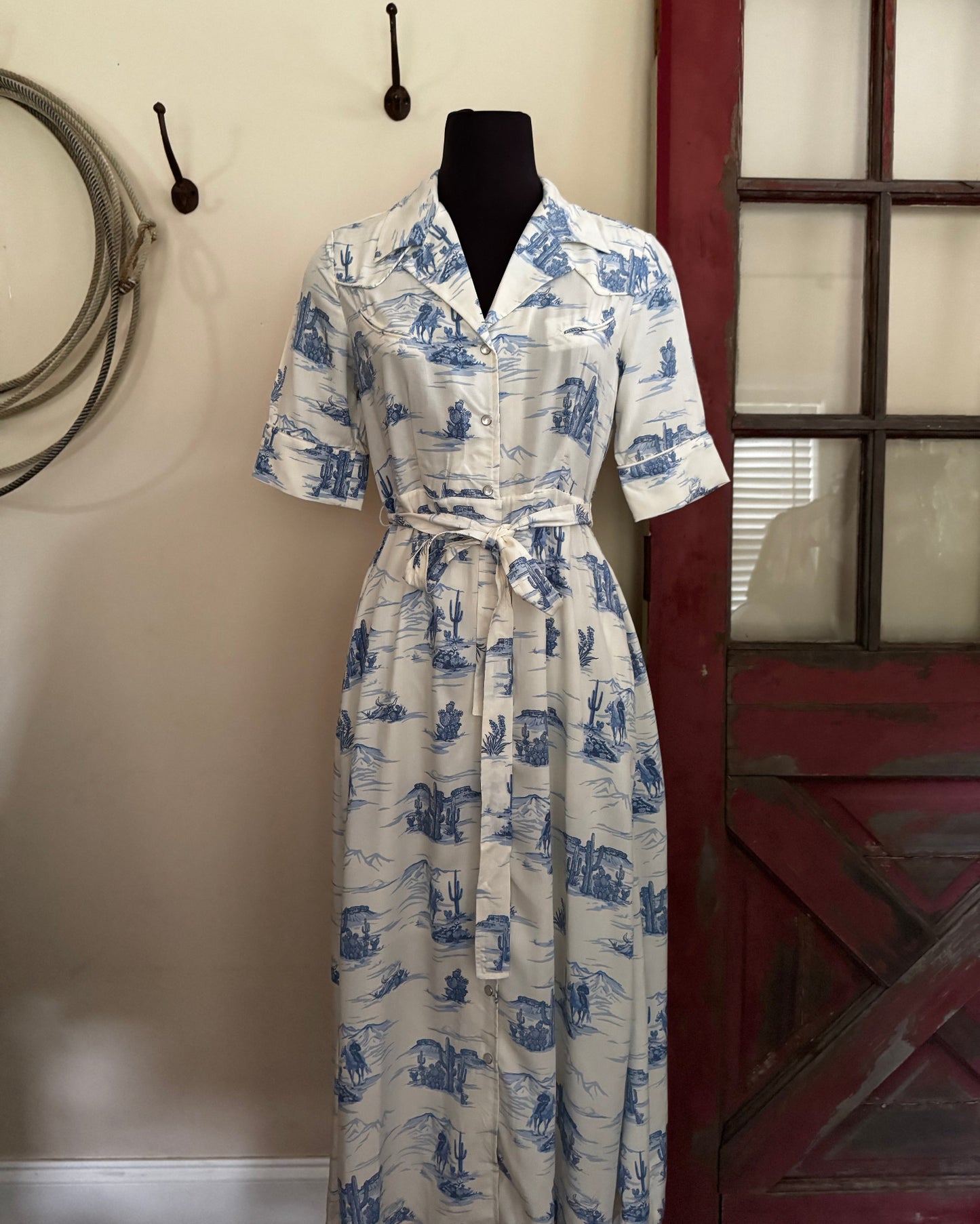 blue and white dress in front of a red door