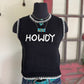 Black sleeveless sweater with 'HOWDY' text on a mannequin against a rustic background.