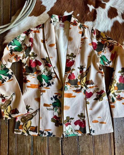 Floral-patterned jacket on a wooden surface with a cowhide rug in the background