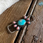 Twilly slide with turquoise and pink conch on rustic wooden surface