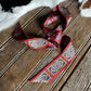Decorative ribbon with a pattern on a wooden surface
