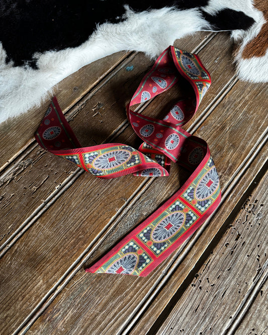 Decorative ribbon with a pattern on a wooden surface
