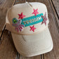 An Alien Yeehaw Trucker hat with custom patches
