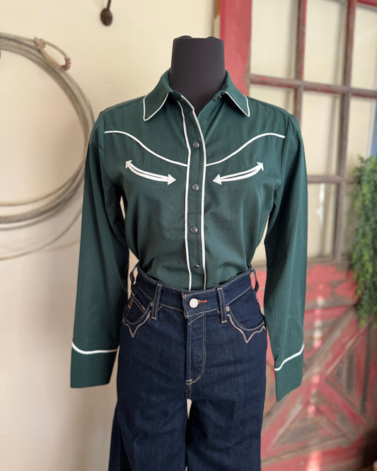 Green western-style shirt with white accents on a mannequin against a neutral background