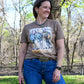 Cowgirls & Cowboy Hats Tee on model with wooded background 
