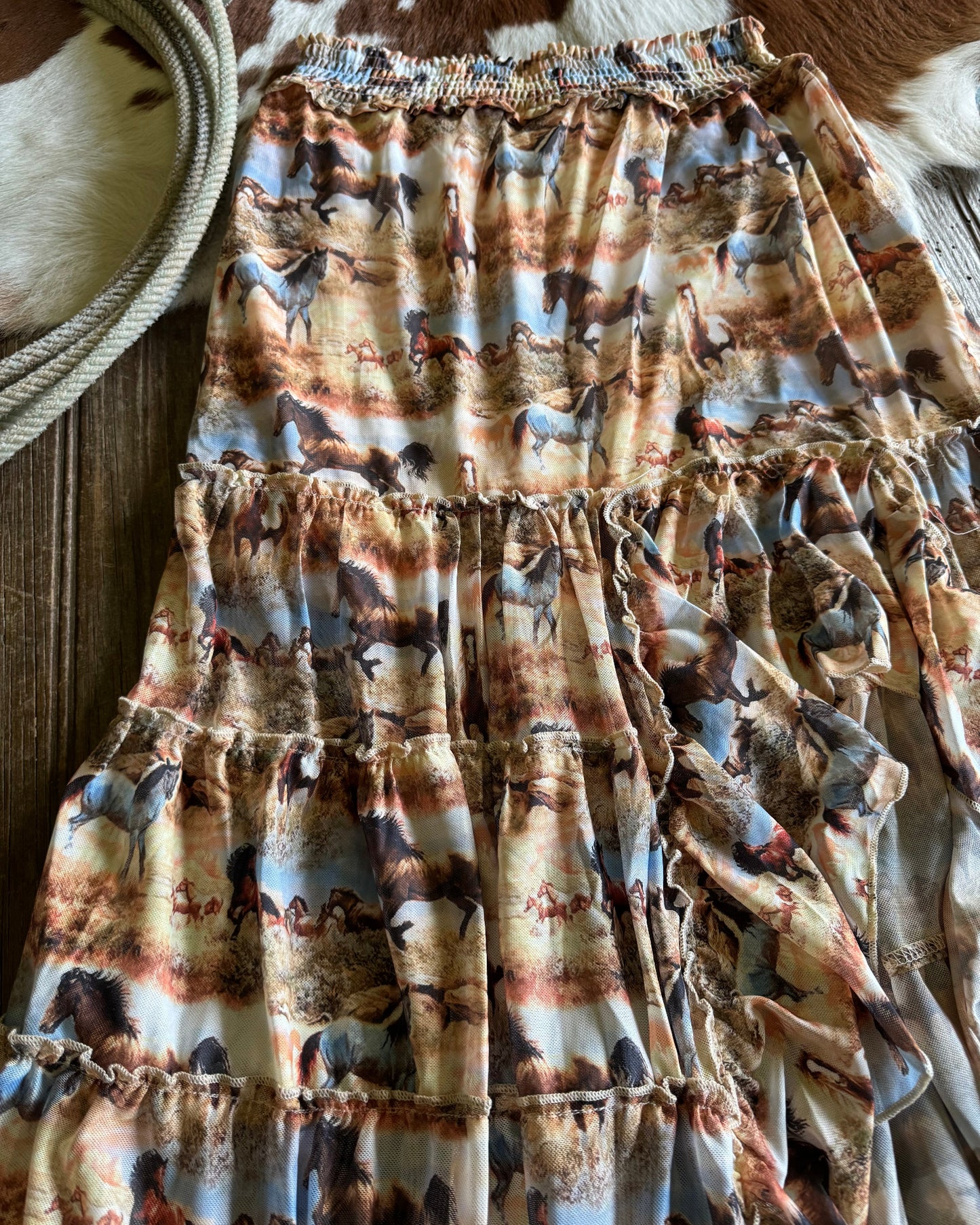 Textured fabric with earthy tones on a wooden surface