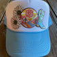 Front view of Stay Wild Daisy trucker hat with custom patches