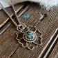 Necklace with a decorative pendant on a wooden surface