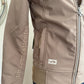 Brown jacket with a brand logo on a white surface