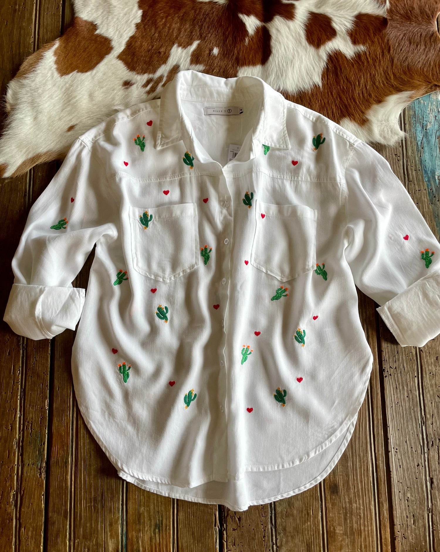white shirt with embroidered cacti