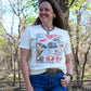 10 Gallon Hat Tee on model with wooded background 