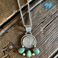 Dime necklace on a rustic wooden background