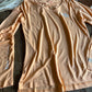 Beige shirt on a wooden surface