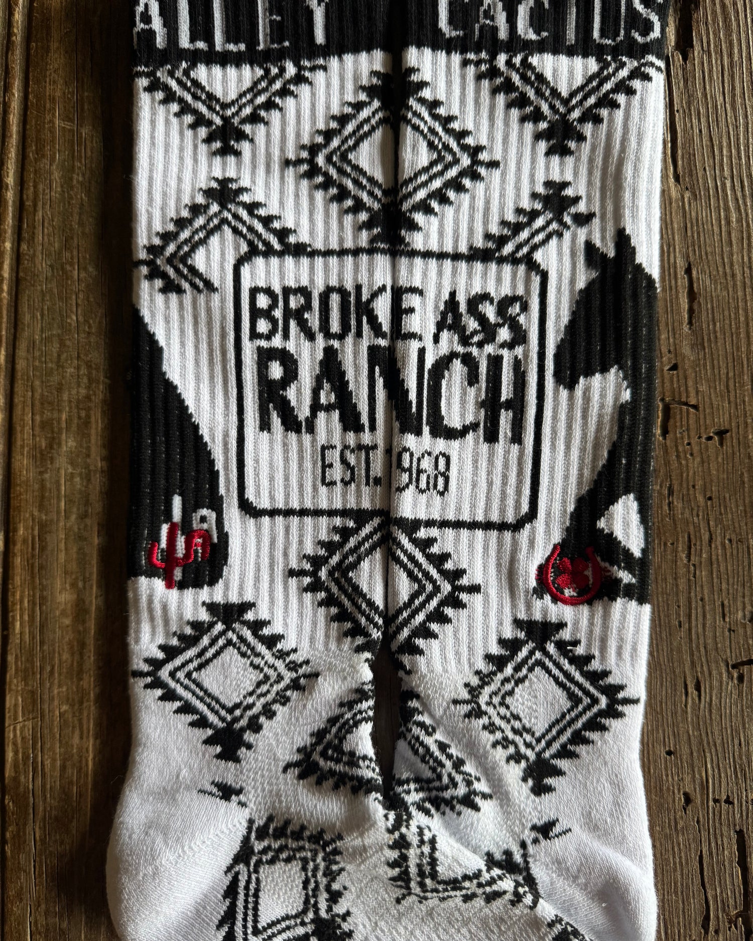 Cactus Alley - Broke A$$ Ranch Performance Socks (Black/White) on rustic wood background