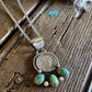 Dime necklace with turquoise stones on rustic wooden background