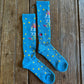 Shine Like a Star Performance Socks in turquoise on rustic wood background 