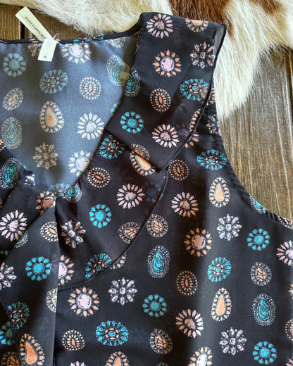 Folded fabric with floral pattern on a wooden surface
