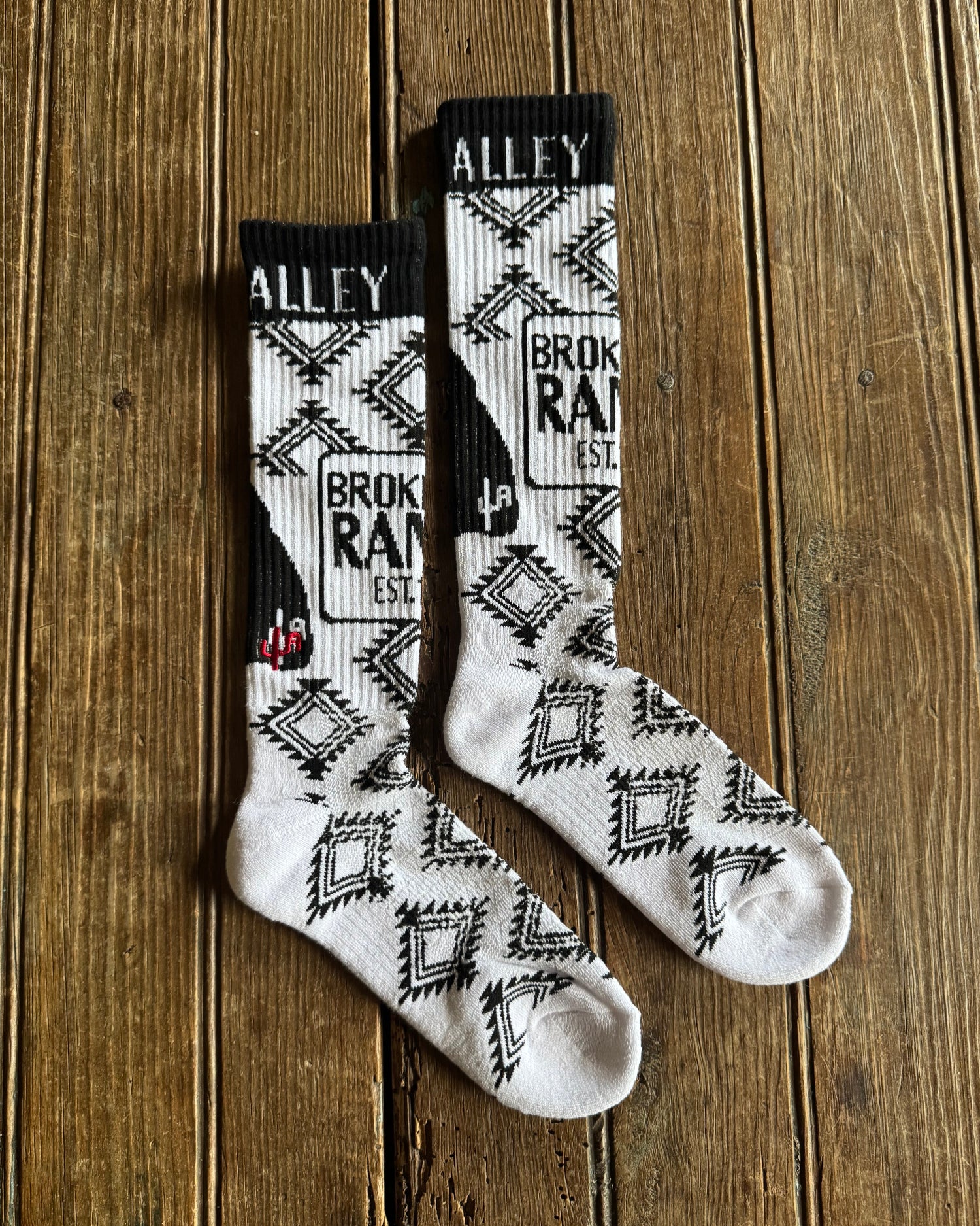 Cactus Alley - Broke A$$ Ranch Performance Socks (Black/White) on rustic wood background