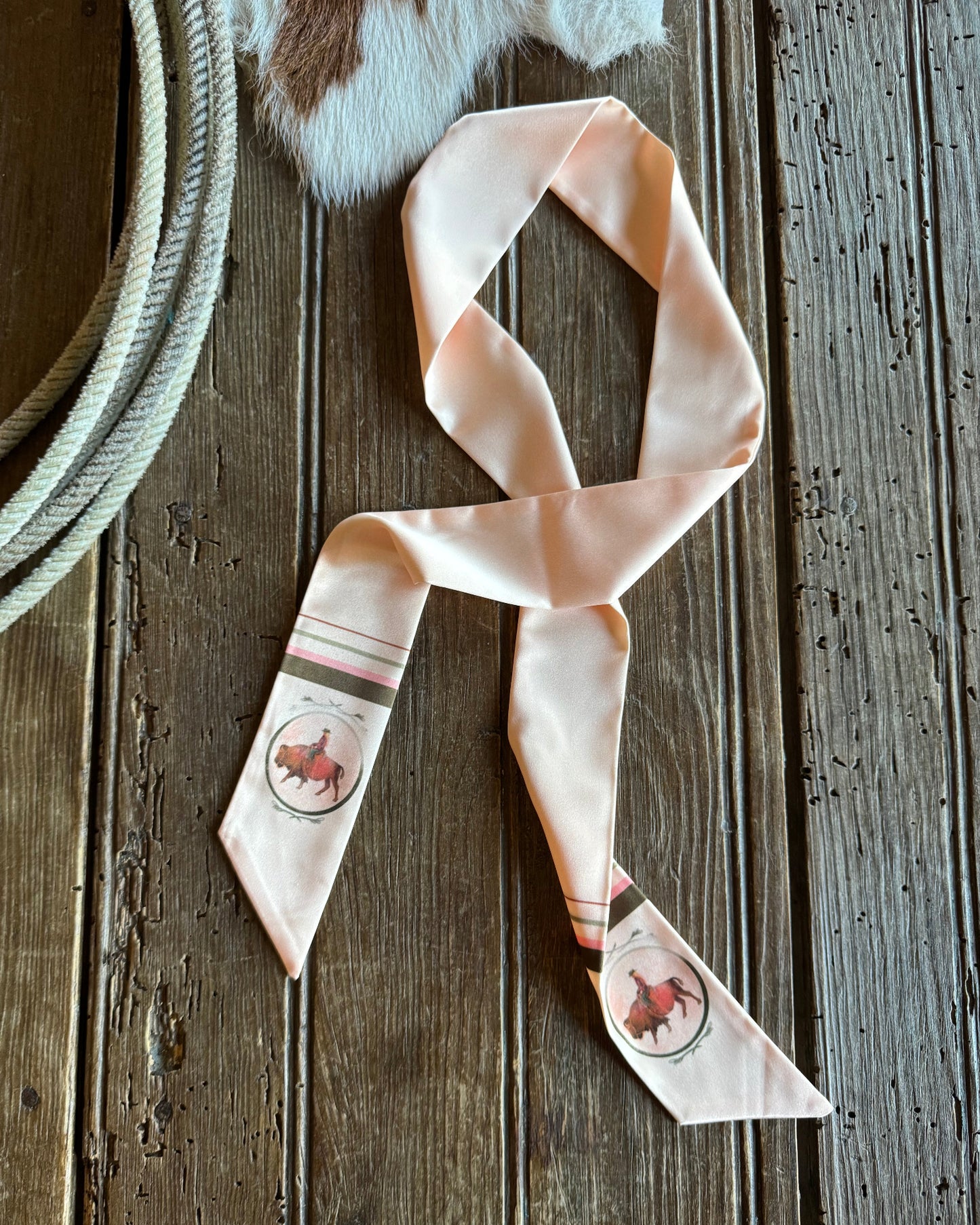 twilly scarf with buffalo on a rustic wood background and a rope 