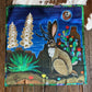 Decorative scarf with a jackalope and nature design on a wooden surface