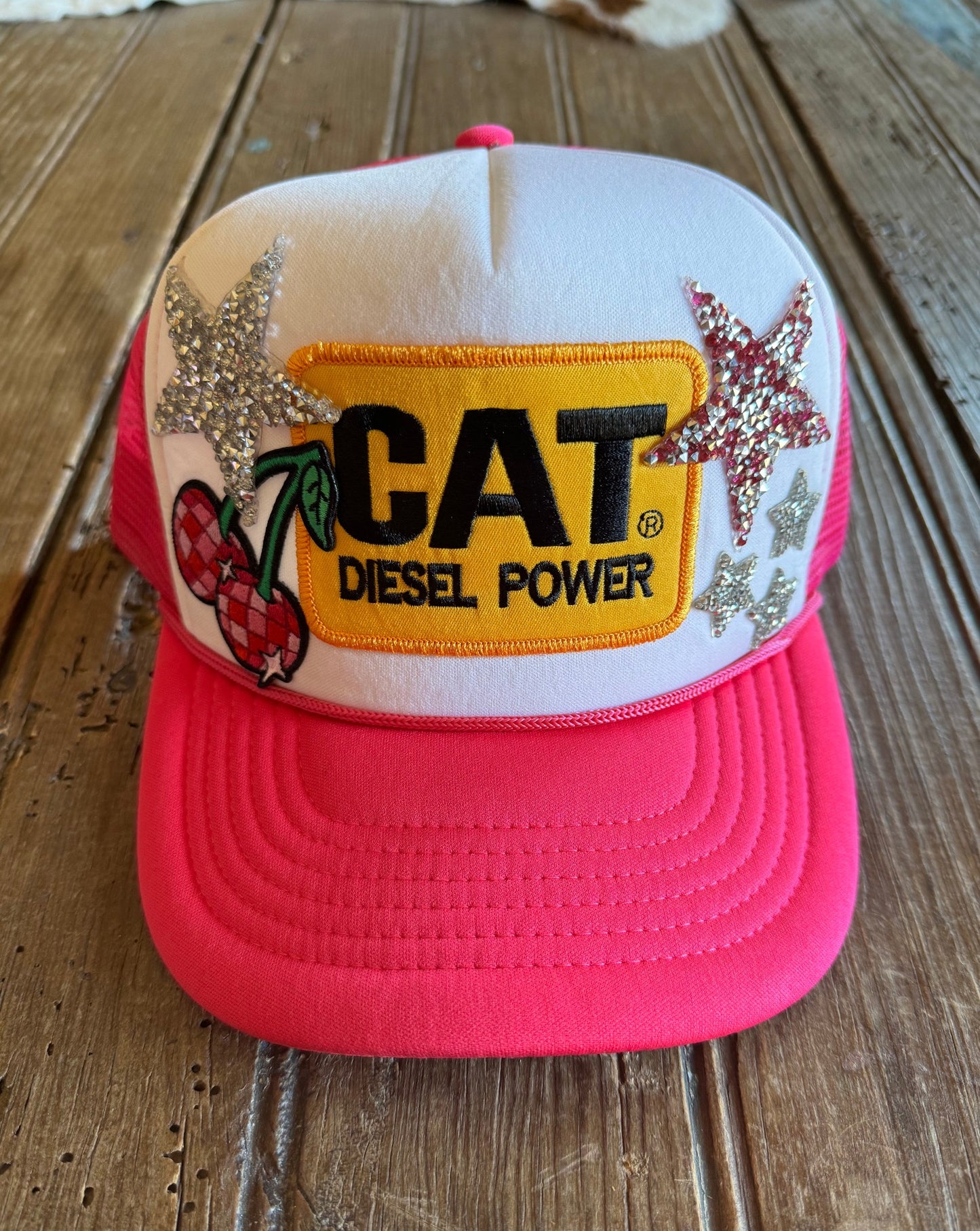Front view of cats & cherries trucker hat