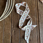 ribbon scarf with floral pattern on a wooden surface