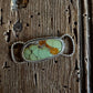 Hubei Turquoise twilly slide on a rustic wood background