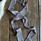 Patterned fabric strip on a wooden surface